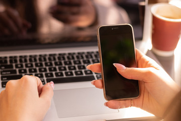 Smartphone user with laptop