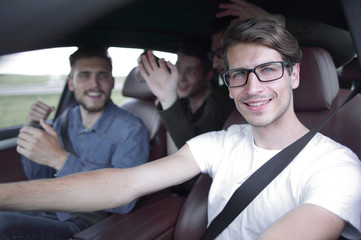 Close up side portrait of happy man driving car