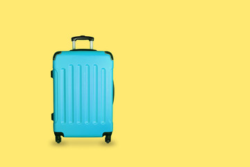 Travel suitcase on blue background