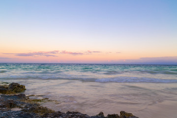 Sunset over the beach of the Riviera Maya in Tulum, Quintana Roo, Mexico