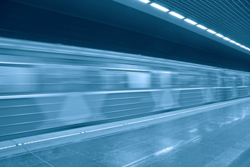 Blurred image of a fast moving train in the subway