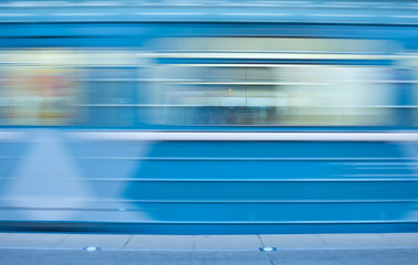 Blurred image of a fast moving train in the subway