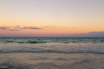 Fototapeta na wymiar Sunrise over the beach of the Mayan Riviera in Tulum, Quintana Roo, Mexico