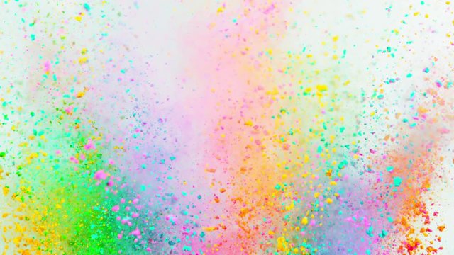 Super slowmotion shot of color powder explosion isolated on white background.