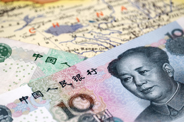 Yuan bills on the map of China. Concept for chinese economy, investment and trading in Asia