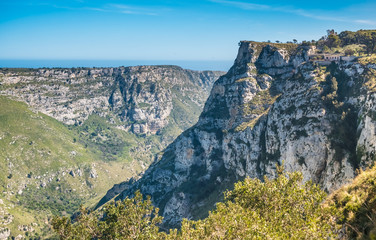 Fototapeta premium Cava Grande del Cassibile Natural Reserve, Siracusa, Sicily, Italy. One of Europe’s biggest canyons, dug by the river Cassabile through majestic mountains and filling emerald lakes and waterfalls.