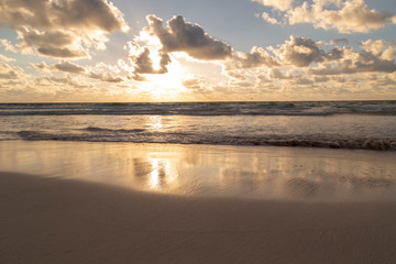 Fototapeta na wymiar Sunset over the beach of the Mayan Riviera in Tulum, Quintana Roo, Mexico