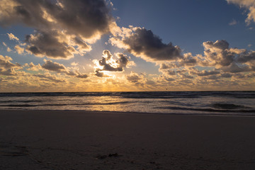 Obraz premium Sunset over the beach of the Mayan Riviera in Tulum, Quintana Roo, Mexico