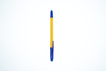 orange pen with blue cap on white background