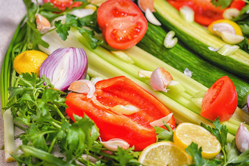 Fresh vegetables. Colorful vegetables background.Still life of fresh fruits: pepper, lemon, tomato, cucumber, onion, green onion, parsley, garlic, celery.Concept of healthy eating.