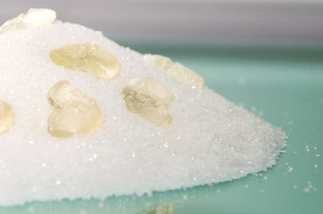 Sugar background. Granulated sugar with skulls from sugar. Harm of eating sugar concept. Sweet leads to diabetes.