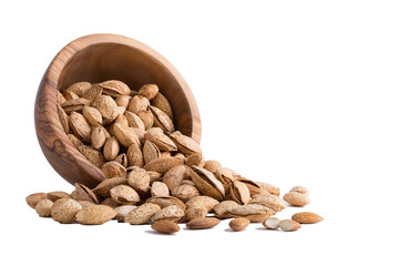 Almonds with shell in bowl Isolated on white background