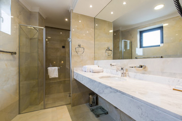 Hotel bathroom interior with shower cabin