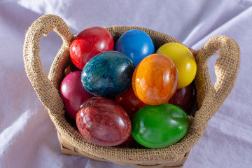 Cooked chicken eggs for Ester celebration dinner, colorful painted with organic paint ready to eat