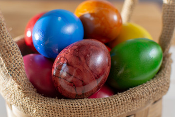 Cooked chicken eggs for Ester celebration dinner, colorful painted with organic paint ready to eat