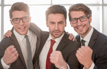 Fototapeta premium close up.three happy businessmen
