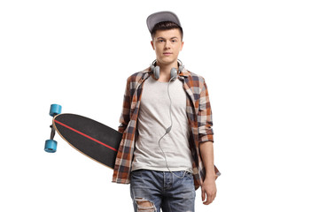 Trendy teenage skater with a longboard