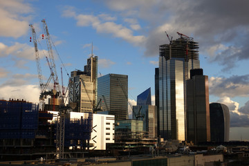 Obraz premium Photo from iconic modern skyscrapers in business district of Bank as seen from rooftop at dusk with beautiful clouds, London, United Kingdom