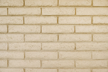 Old beige brick wall background texture