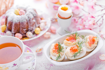 Easter breakfast.Cake and eggs with salmon