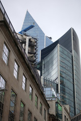 Photo from iconic modern skyscrapers in business district of Bank in the heart of London on a cloudy sky, London, United Kingdom