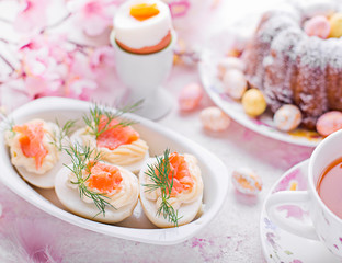 Easter breakfast.Cake and eggs with salmon