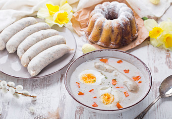 Easter breakfast. Sour rye soup with eggs and sausage