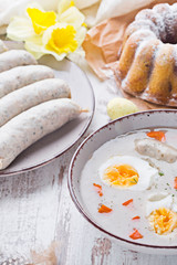 Easter breakfast. Sour rye soup with eggs and sausage