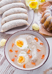Easter breakfast. Sour rye soup with eggs and sausage