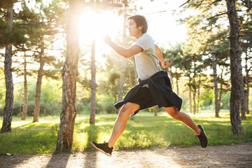 Full length of a confident asian athlete man running