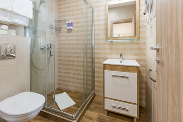 Hotel bathroom interior with shower cabin