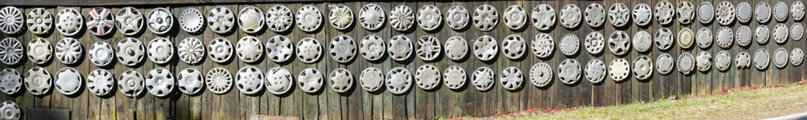 Fototapeta premium Big collection hubcaps on wall