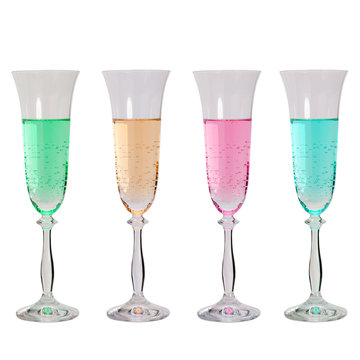 Colored liquids in glasses on white background