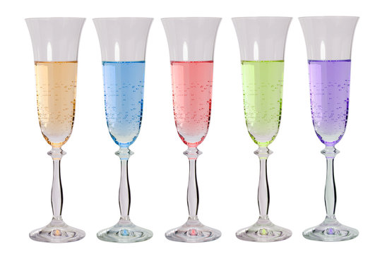 Colored liquids in glasses on white background