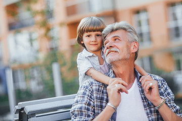 Grandfather with a grandson on a walk