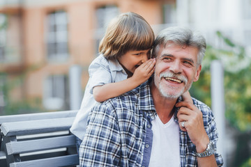 Grandfather with a grandson on a walk