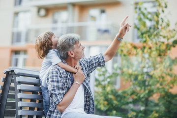 Grandfather with a grandson on a walk