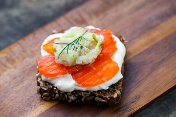 Scandinavian dark bread with cured trout , micro herbs, cucumber chutney and horseradish cream 
