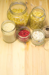 natural packaging glass jars for bulk pasta products, thoughts, rice selective focus 