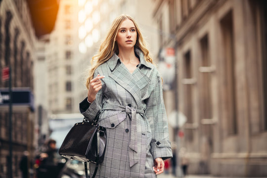 Successful Young Adult Business Woman With Black Bag Walking To The Job On New York City Street At Financial District