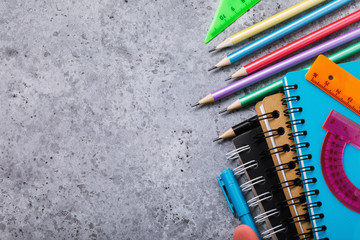 School supplies on the desk with copy space. Top view on pencils, notebooks and rulers