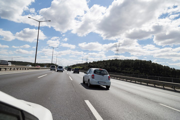 Fototapeta premium Cars on busy road driving in evening.
