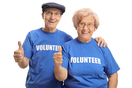 Portrait of cheerful senior couple volunteers giving thumbs up