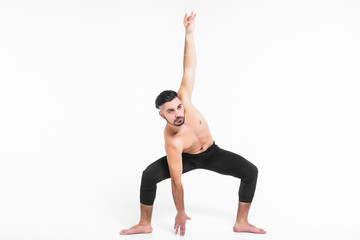 Handsome young ballet dancer on white background.