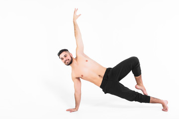 Handsome young ballet dancer on white background , modern tricks.