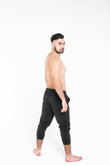 Fototapeta premium Stylish boy stay on back and looking to the camera, isolated on white!