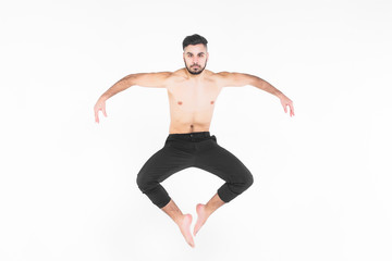 Young, acrobat man doing exercise  in the air isolated on white!