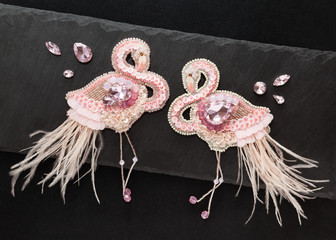 Beautiful handmade gentle pink flamingos brooches with crystals,feathers and seed beads, lying flat...