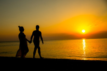 loving couple by the seaside sunset