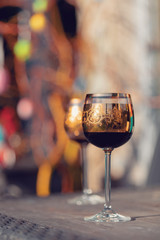 vine glass and easter eggs in blurry background. Spring easter concept.